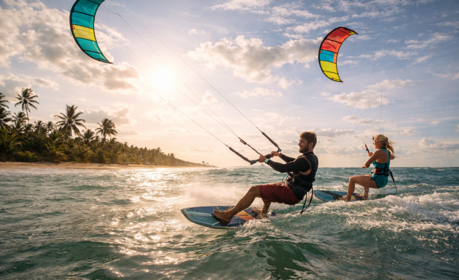 Kite surfers riding waves on Sri Lanka beach with colorful kites